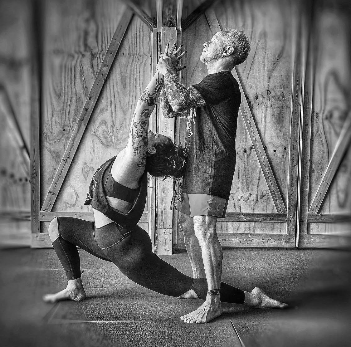 Philip Clift giving a hands-on adjustment at Renegade Yoga